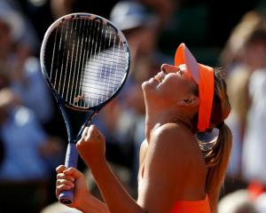 Maria Sharapova celebrates her win over Eugenie Bouchard. REUTERS/Vincent Kessler