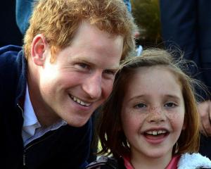 Neave Cameron (7), of Queenstown gets Prince Harry to pose for a photograph at the Stewart Island...