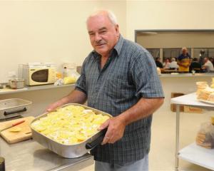 Neil Gamble, Dunedin Ice Stadium manager, in the kitchen cooking for the curling competitors....