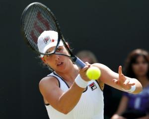 New Zealand's Marina Erakovic hits a return to Britain's Laura Robson during their women's...