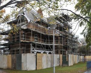 Painters continue maintenance work on the University of Otago professorial houses, north of the...