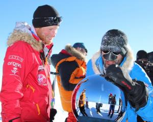 Prince Harry arrives at the South Pole with other members of the expedition. REUTERS/Walking With...