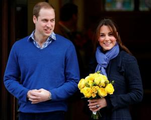 Prince William leaves the King Edward VII hospital in London with his wife Catherine, Duchess of...