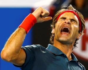 Roger Federer celebrates his victory over Andy Murray. REUTERS/Petar Kujundzic