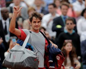 Roger Federer leaves the court after his loss to Ernests Gulbis. REUTERS/Stephane Mahe