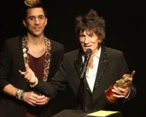 Ronnie Wood accepts the award for Best Music Film for 'Crossfire Hurricane' by the Rolling Stones...