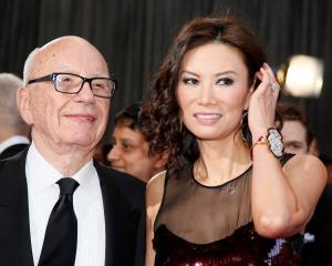 Rupert Murdoch arrives with his wife Wendi Deng at the 85th Academy Awards in Hollywood,...