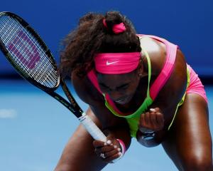 Serena Williams reacts after winning a point against Garbine Muguruza. REUTERS/Issei Kato