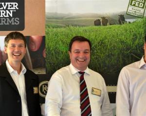 Silver Fern Farms chief executive Keith Cooper (centre) catches up with Marcus Glucina (left) and...