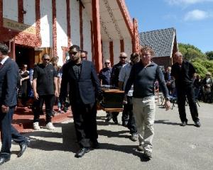 Solemn procession out of Te Whare Tamatea at a funeral at Otakou marae yesterday for Marty...