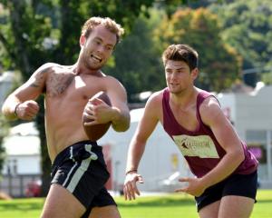 Students Callum Mulligan (19, left) and Simon Roberts (20), both of Christchurch, play a game of...