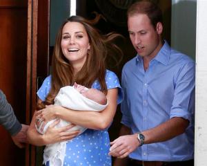 The Duke and Duchess of Cambridge emerge from St Mary's Hospital with their baby boy yesterday....