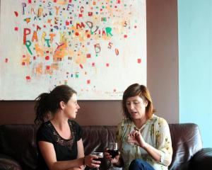 The Perc cafe owner Sarah Henderson (left) and Zaibatsu Hair Art owner Jaimee Smith discuss their...