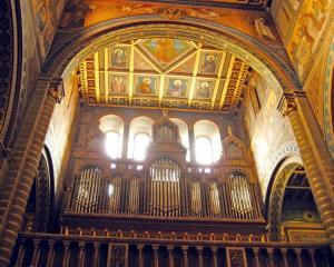 The pipe organ and ornately painted walls at St Peter's Cathedral in Pecs, Hungary. Photo:...