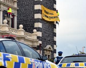 The protest banner three climbers unfurled  on behalf of  Greenpeace and Oil Free Otago on...