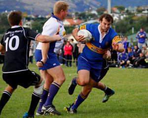 The Taieri halfback charges for the tryline.