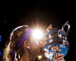 Victoria Azarenka of Belarus poses with the Daphne Akhurst Memorial Cup after defeating Li Na of...