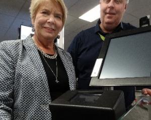 Customs Minister Nicky Wagner and Queenstown Airport operations general manager Mike Clay try out...