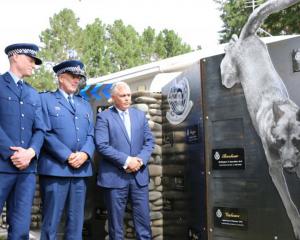 Constable Josh Robertson (left), Senior Const Bruce Lamb and Associate Justice Minister Mark...