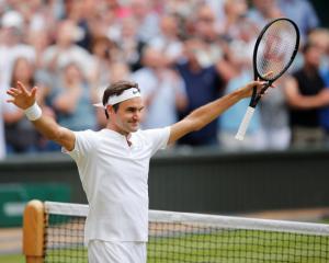 Switzerland’s Roger Federer celebrates winning the semi final match against Czech Republic’s...