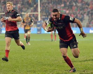  Bryn Hall of the Crusaders runs through to score a try. Photo: Getty