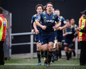 Ben Smith of the Highlanders leads his team onto the field. Photo: Getty