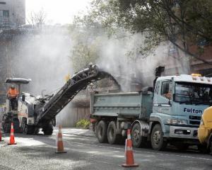 Contractors remove asphalt from Cumberland St by the University of Otago this week for the one...