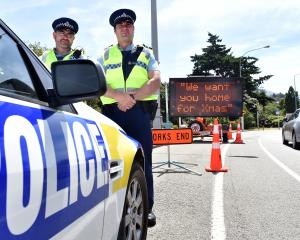 Acting Senior Sergeant Bryce Johnson (left) and Acting Otago Coastal Area Road Policing manager...