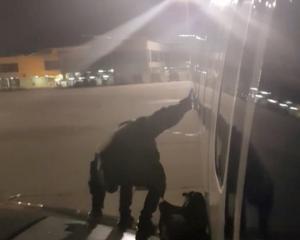 Still image taken from video shows a man leaving plane via emergency exit after delay in Malaga. Photo: Courtesy of Facebook/ @ Fernando del Valle Villalobos via Reuters