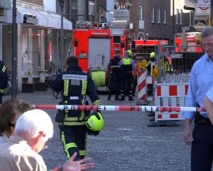 Police block a street in Muenster where a vehicle drove into a group of people killing several...