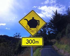 A "modified" sign in Waitati expresses a sense of community. Photos: Supplied