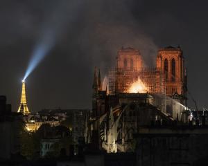 Flames and smoke rise from the Notre Dame Cathedral in Paris last week. Photo: Getty Images