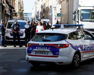 Police patrol the streets at the weekend during the manhunt of a suspected suitcase bomber in...