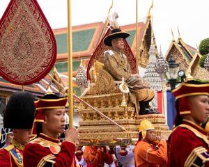 Thailand's King Maha Vajiralongkorn is transported on the royal palanquin. Photo: Committee on...