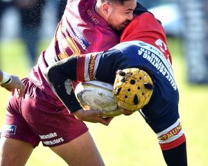 Alhambra-Union centre Rutu Bishop tackles Harbour centre Sala Halaleva at the North Ground last...