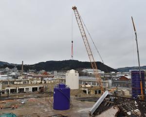 The silos are taken down in August 2021. PHOTO: GREGOR RICHARDSON