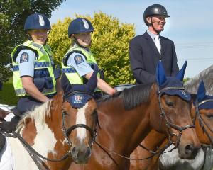 Mounted police officers (from left) Olivia Winbush, on Jericho, Melissa Wallace, on Maotai, and...