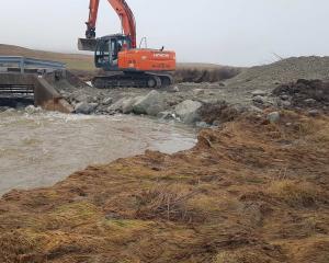 Contractors work to repair the Lake Ohau Rd bridge. PHOTO: SUPPLIED/WAITAKI DISTRICT COUNCIL