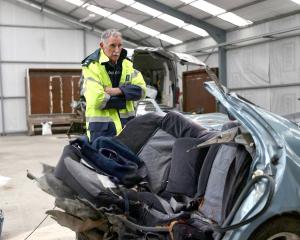 Aoraki Area Commander Inspector Dave Gaskin looks over the wreckage of a car which snapped in...