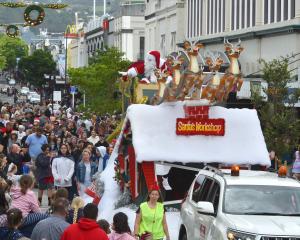 Santa greets the crowd during Dunedin’s Santa Parade yesterday afternoon. PHOTO: GREGOR RICHARDSON