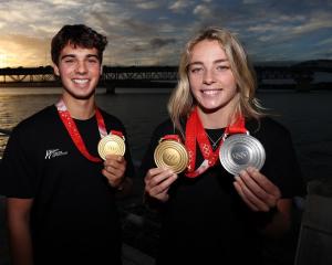 Winter Olympic gold medallists Nico Porteous and Zoi Sadowski-Synnott beam with joy after their...