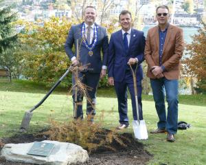 Pictured in front of a young totara, planted to commemorate the coronation of King Charles III at...