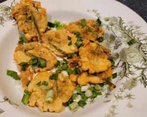 The flower heads, dipped in batter, make an oniony fritter. Photos: Hilary Rowley