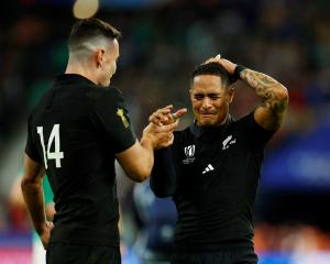 Will Jordan (left) and Aaron Smith celebrate after the All Blacks beat Ireland 28-24 in their...