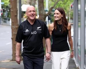 National Party leader and Prime Minister-elect Christopher Luxon and his wife, Amanda, arrive to...