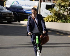 Chris Bishop arrives to meet with other National MP's at Auckland's Cordis Hotel. Photo: NZ Herald 