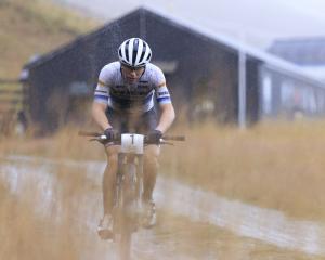 Anton Cooper on his way to claiming victory in the elite men’s cross-country at the national...