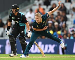 Nathan Ellis of Australia bowls during the final match of the T20 series between New Zealand and...