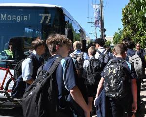 School pupils flock to the No77 bus to Mosgiel. Fares are changing for some young people. PHOTO:...