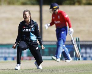 Susie Bates celebrates taking a wicket in the last over of the third T20 International between...